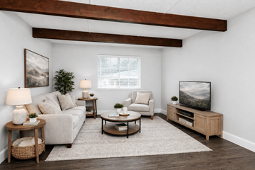 Hilliard townhouse for rent - A living room with a couch, a coffee table, a lamp, and a painting on the wall.