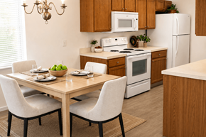 Zanesville apartment for rent - A kitchen with a table set for two and a chandelier hanging above.