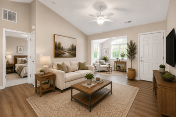 Springfield apartment for rent - A living room with a white couch, a coffee table, and a painting on the wall.