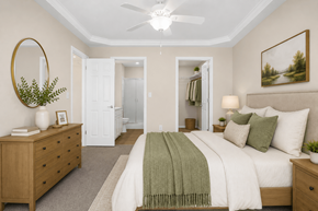 Springfield apartment for rent - A bedroom with a bed, two nightstands and dresser in front of a closet and bathroom.