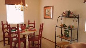 Heath apartment for rent - A dining room with a table set for four.