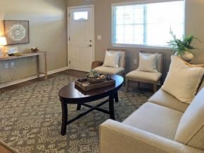 Groveport apartment for rent - A living room with a couch, coffee table, and a window.