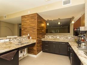 Washington apartment for rent - a large kitchen with granite counter tops and black cabinets
