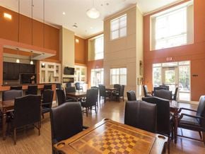 Washington apartment for rent - a dining room with tables and chairs and a chess board