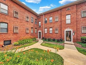 Washington apartment for rent - A red brick building with a walkway in front.