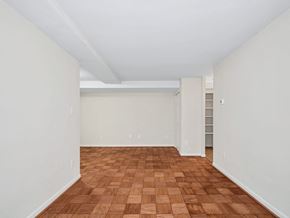 Washington apartment for rent - A room with wooden flooring and white walls.