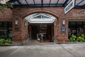 Seattle apartment for rent - The entrance to a building with a sign that reads "Naturopate".