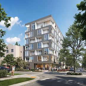 Seattle apartment for rent - A modern apartment building with a sleek design and lush landscaping.