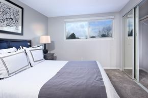 Silverdale apartment for rent - a bedroom with a large bed and a large window