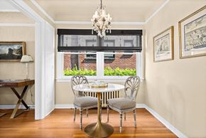 Seattle apartment for rent - a dining room with a table and chairs and a window
