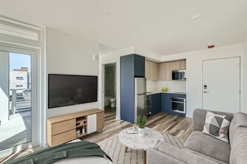Seattle apartment for rent - a living room with a couch and a tv