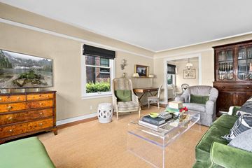 Seattle apartment for rent - a living room with a couch and chairs and a television
