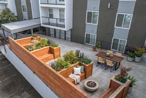 Seattle apartment for rent - A patio with a fire pit and seating area.