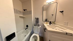 Seattle apartment for rent - a small bathroom with a sink toilet and bath tub
