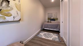 Seattle apartment for rent - a bedroom with a bed and a painting on the wall