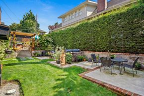 Seattle apartment for rent - a patio with a table and chairs in a backyard