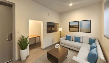 Seattle apartment for rent - a living room with a white couch and a coffee table