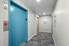 Seattle apartment for rent - a blue door in a hallway of a building