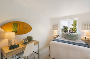 Seattle apartment for rent - a bedroom with a surfboard on the wall