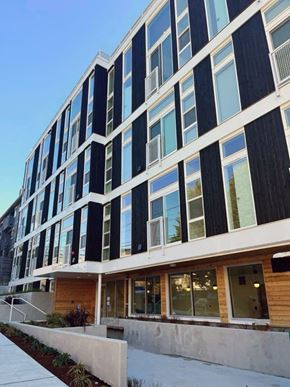 Seattle apartment for rent - an office building with a sidewalk in front of it
