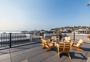 Seattle apartment for rent - A balcony with chairs and a view of the city.
