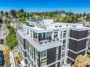 Seattle apartment for rent - an aerial view of a tall building with balconies on top of it