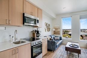 Seattle apartment for rent - an open kitchen and living room with a view of the city