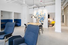 Seattle apartment for rent - WiFi lounge with blue chairs and a table at Alt Capitol Hill.