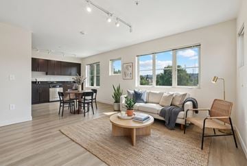Seattle apartment for rent - A modern living room with a dining table and chairs.