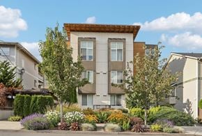 Seattle apartment for rent - A modern apartment building with a landscaped front yard.