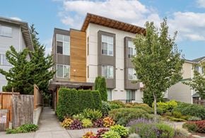 Seattle apartment for rent - A modern two-story house with a garden in front.