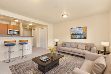 Seattle apartment for rent - a living room with a couch and a table