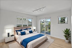 Seattle apartment for rent - a bedroom with a bed and two windows
