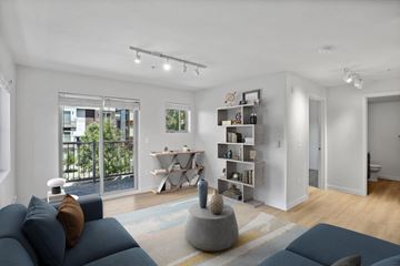 Seattle apartment for rent - a living room with a blue couch and a rug