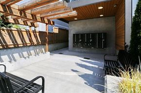 Seattle apartment for rent - a large patio with benches and a wall in the background