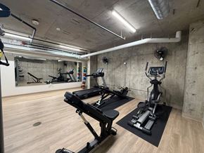 Seattle apartment for rent - A gym with treadmills and weight machines.
