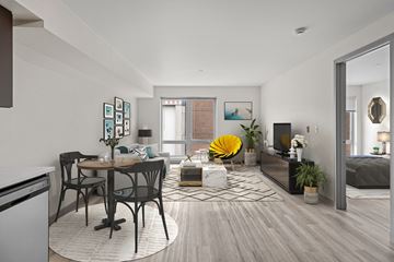 Seattle apartment for rent - A modern living room with a dining table and chairs.