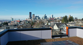 Seattle apartment for rent - A cityscape with buildings and a clear sky.