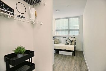 Seattle apartment for rent - a living room with a couch and a window and a closet