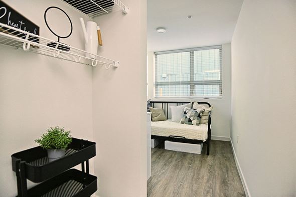 Seattle apartment for rent - a living room with a couch and a window and a closet