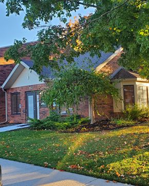 Lapeer apartment for rent - a brick house with a tree in front of it
