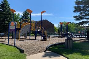 Imlay City apartment for rent - a playground with a bunch of kids playing on it