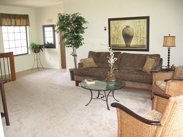 Lapeer apartment for rent - a living room with a couch and a table