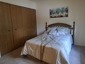 Imlay City apartment for rent - a bedroom with a bed and a closet