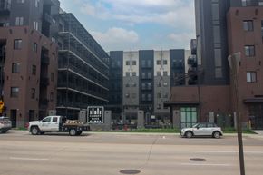 Lincoln apartment for rent - a city street filled with cars and tall buildings