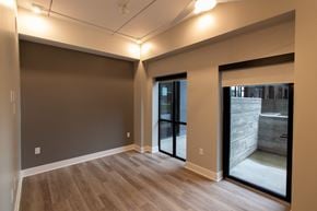 Lincoln apartment for rent - a living room with wood floors and a sliding glass door