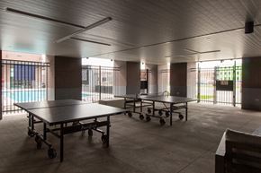 Lincoln apartment for rent - a large room with ping pong tables and a pool