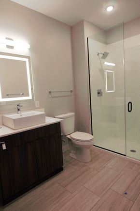 Lincoln apartment for rent - a small bathroom with a shower and a sink and a toilet
