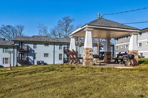 Atlanta apartment for rent - a patio with a gazebo in front of some apartments