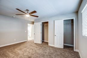Atlanta apartment for rent - a bedroom with a ceiling fan and two closets